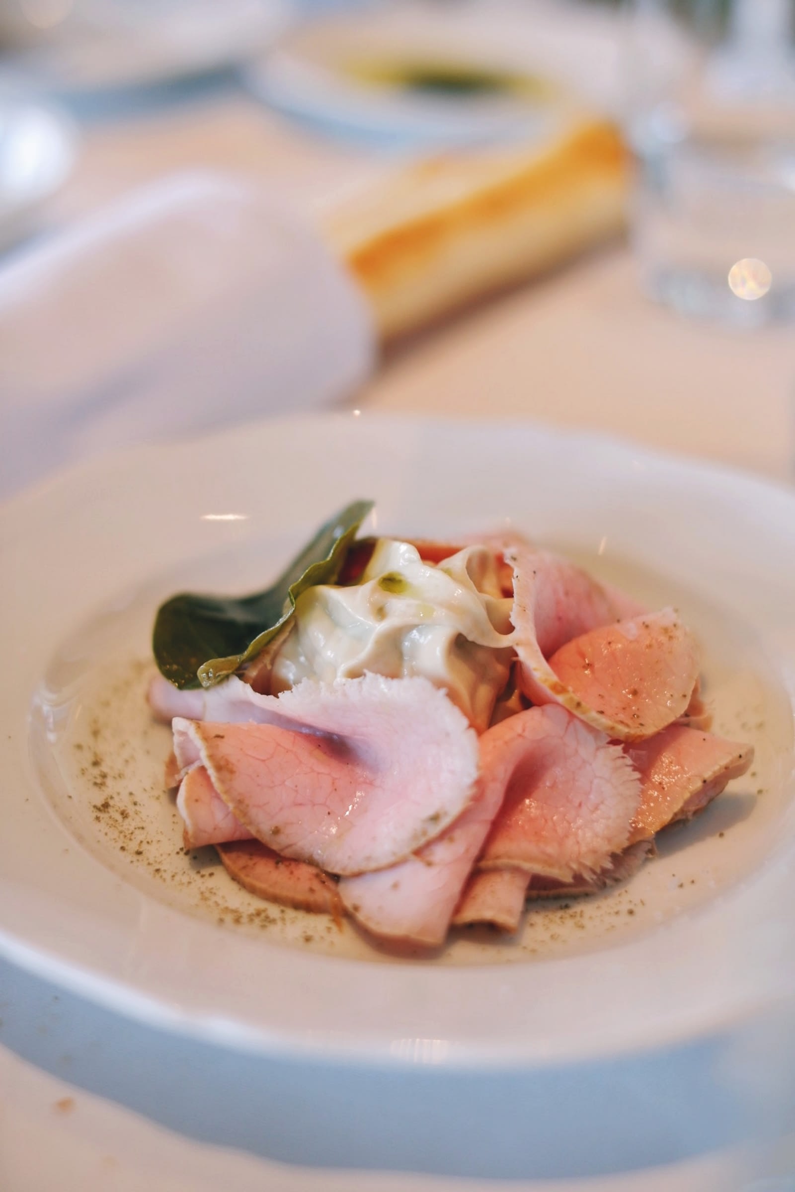Vitello tonnato (milk fed veal, tuna sauce, caper leaf)