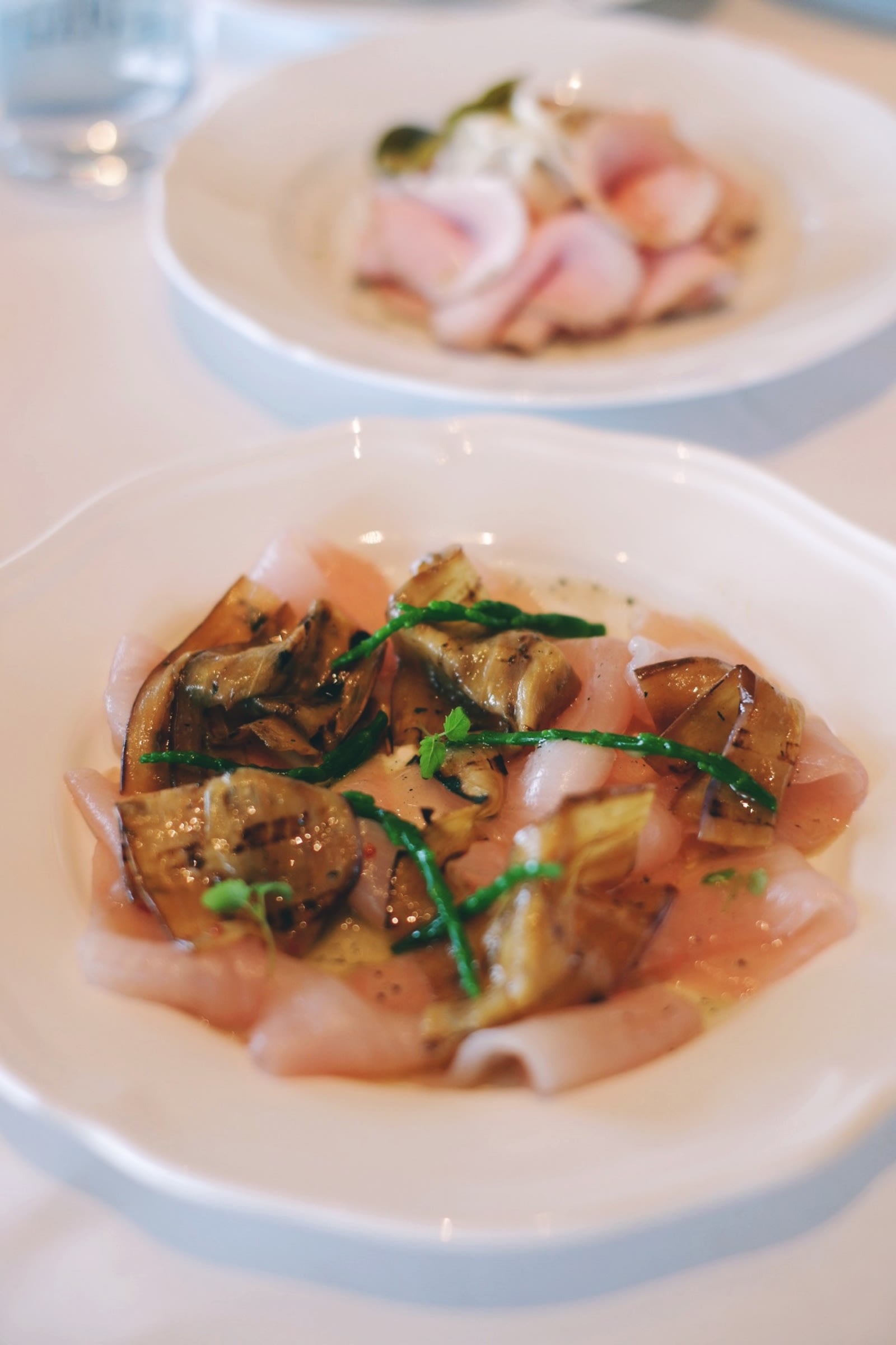 Carpaccio di ricciola (yellowtail carpaccio, eggplant, anchovies colatura, lemon balm)