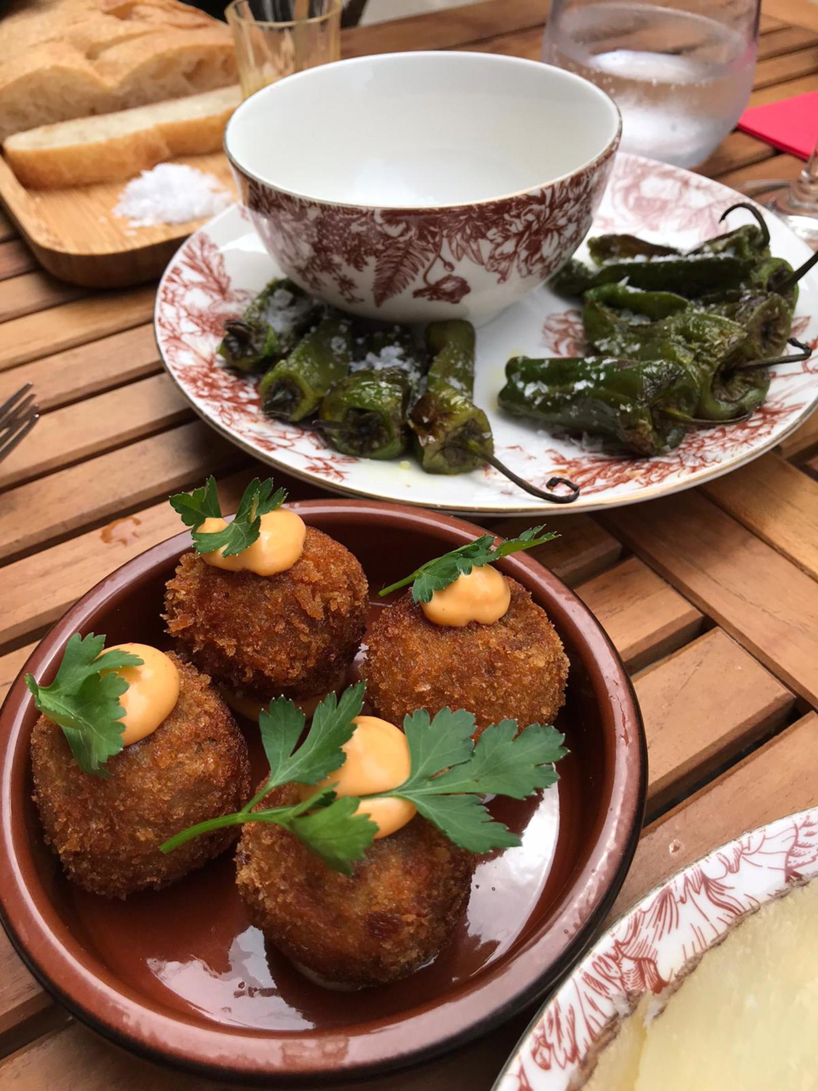 Black Angus Croquettes & Padron Peppers. Image by Akimenko