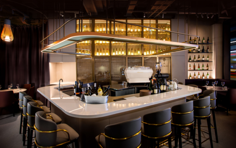 The bar at 'mato' in Hong Kong is a gorgeous blend of gold, white and muted blacks.